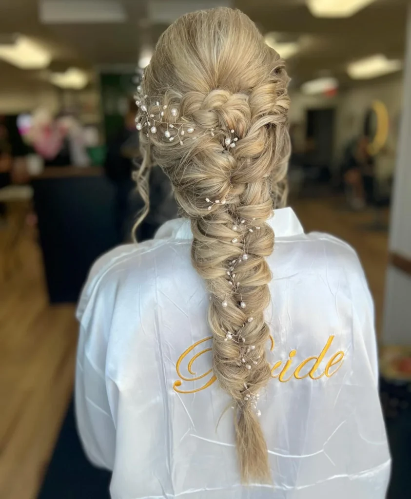 Extra-long blonde pull-through bridal ponytail decorated with a delicate pearl hair vine.