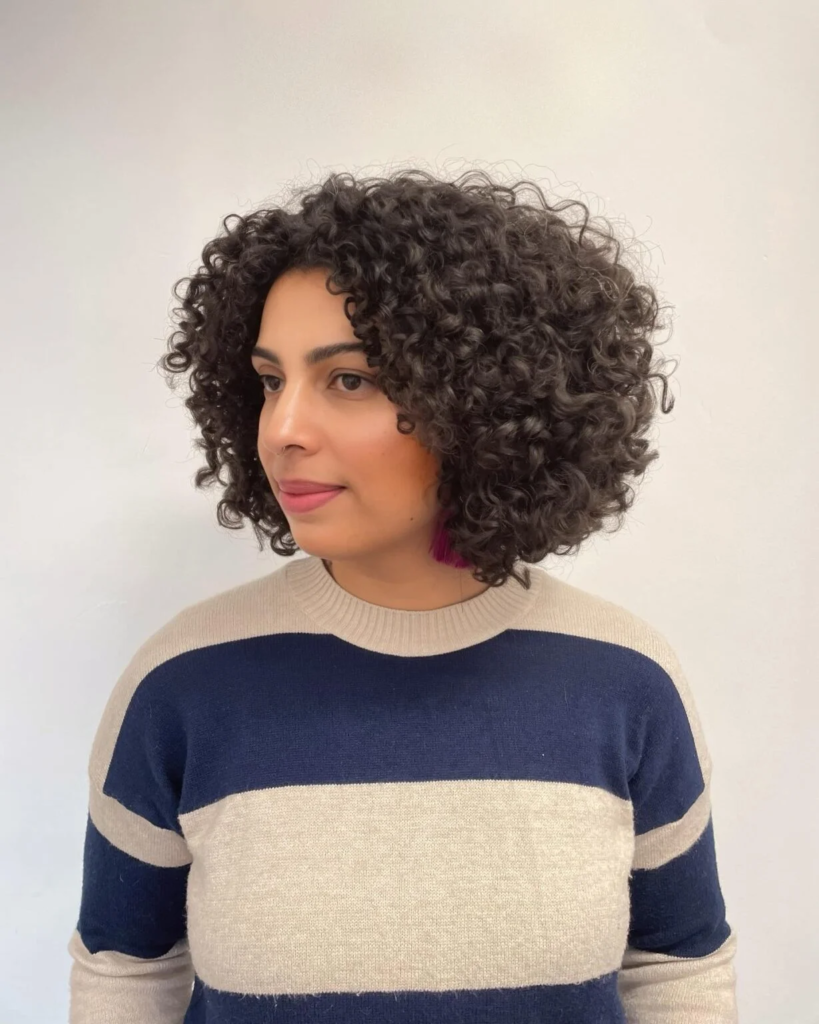 Side-view rounded curly bob haircut