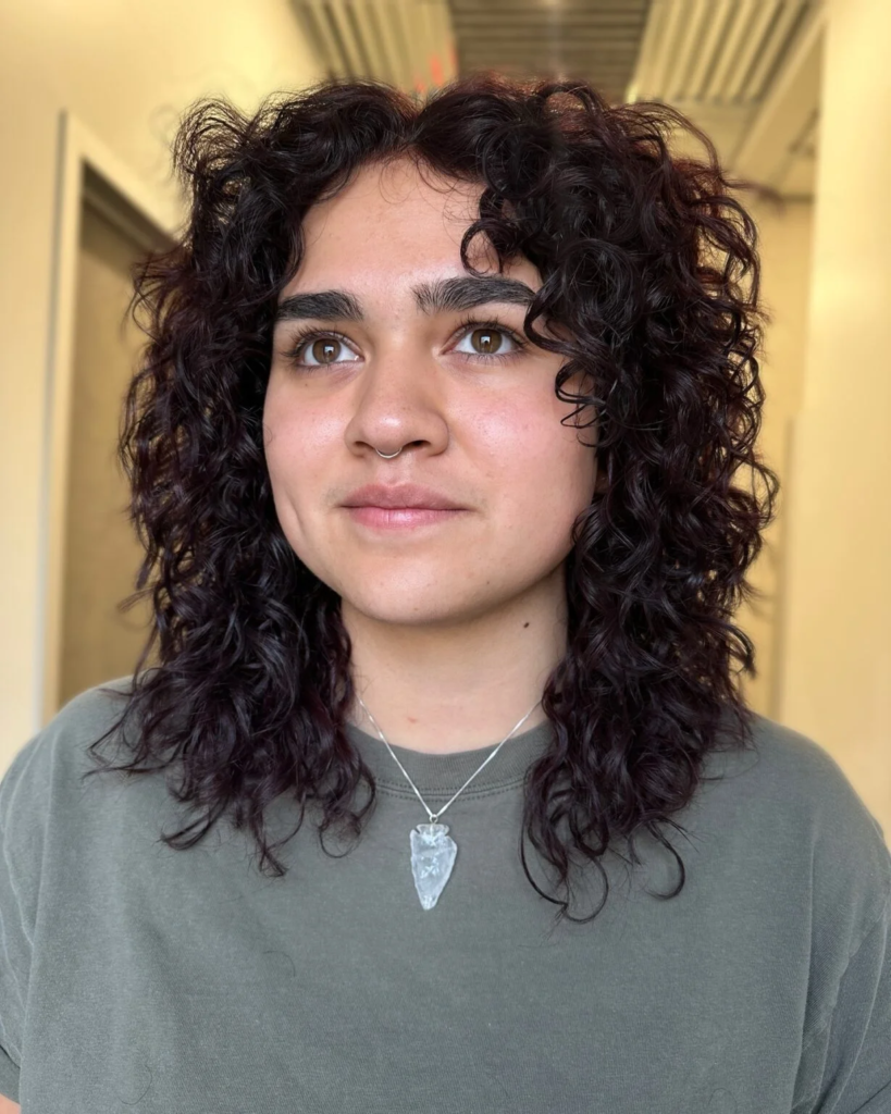 Medium curly layers with face-framing pieces
