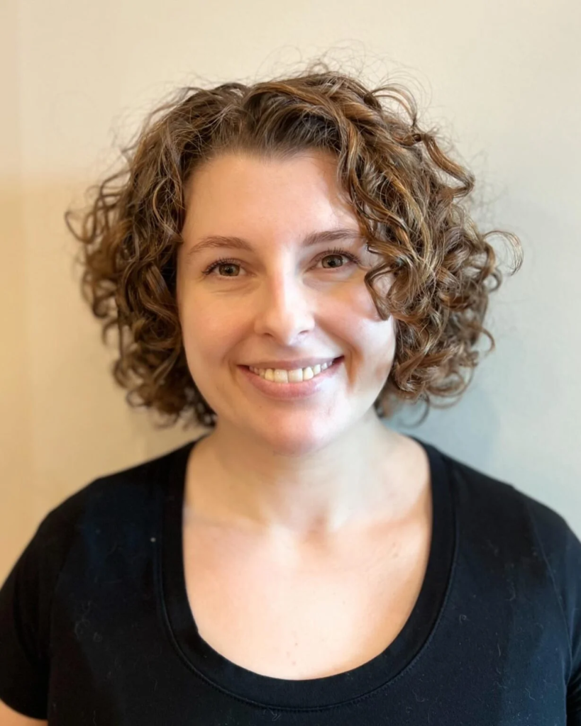 Short wavy-curly bob with side bangs