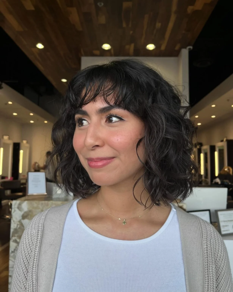 Rounded curly bob with side profile shape