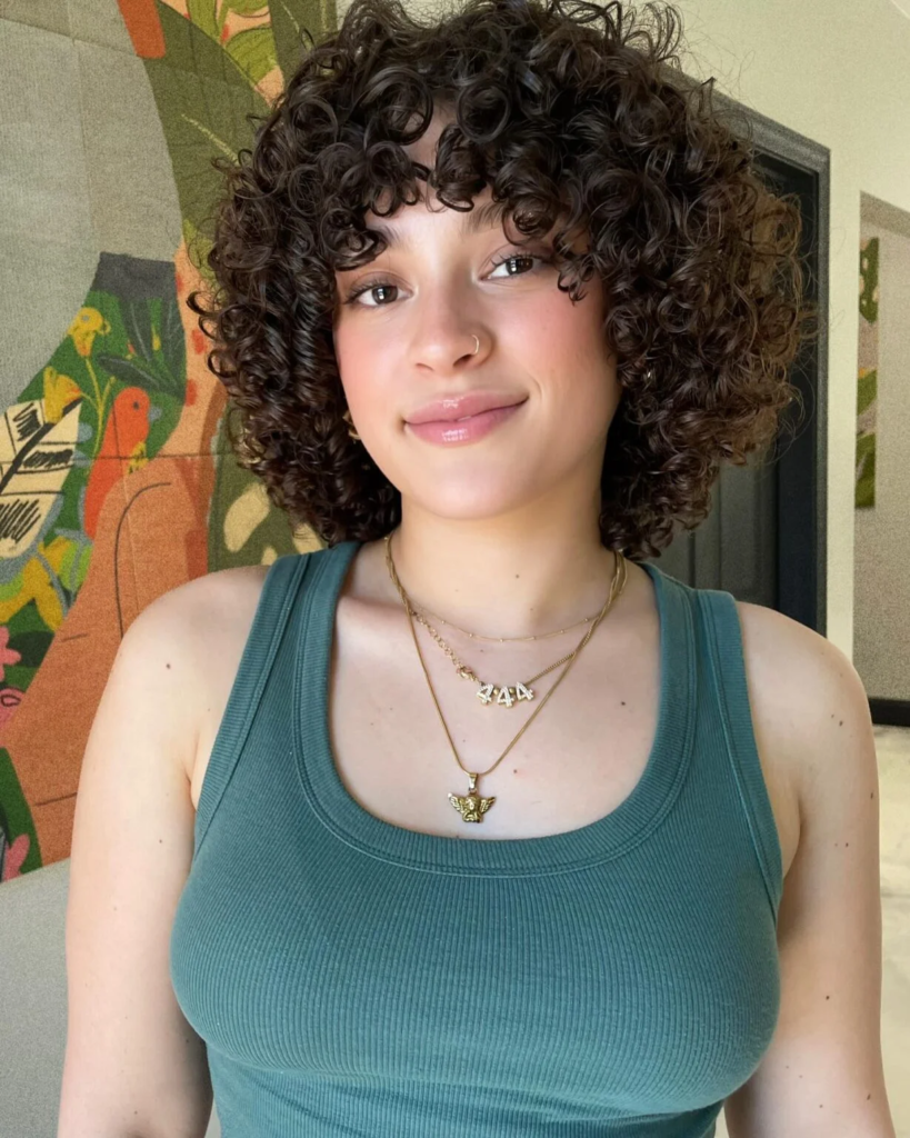 Soft curly bob with defined ringlets and curly bangs