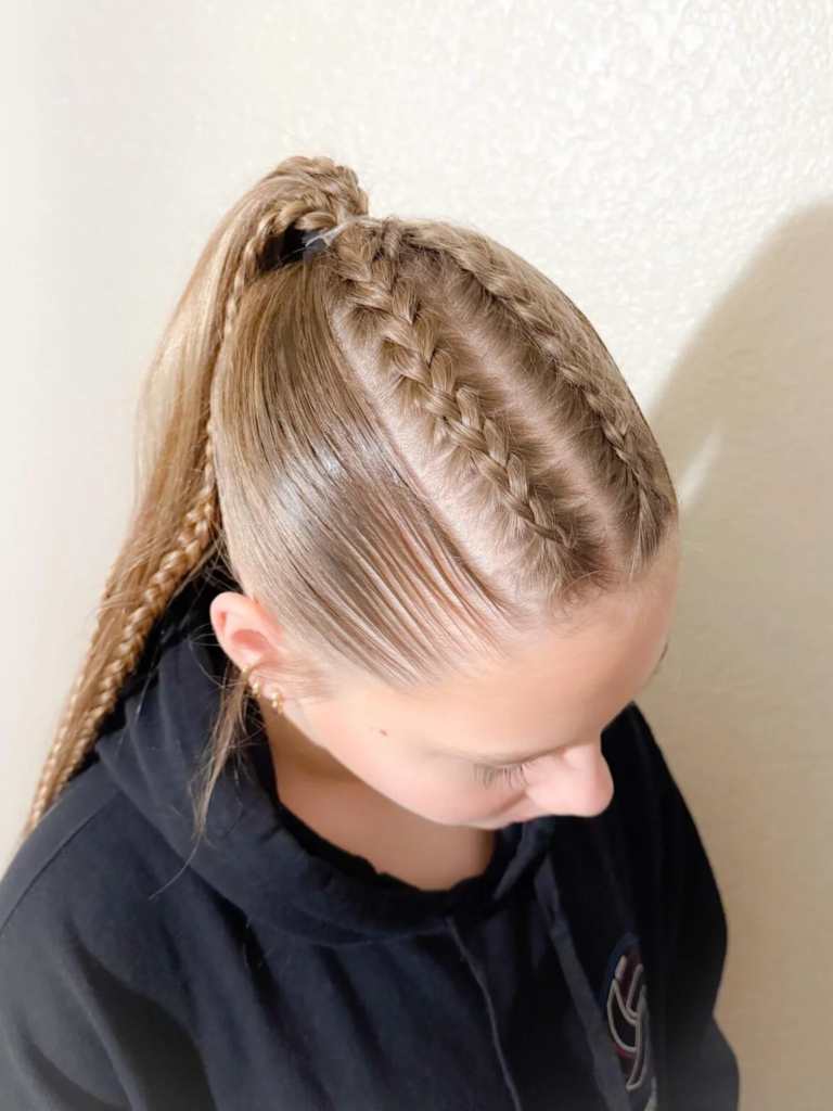 Fine Dutch braid rows leading into a high ponytail