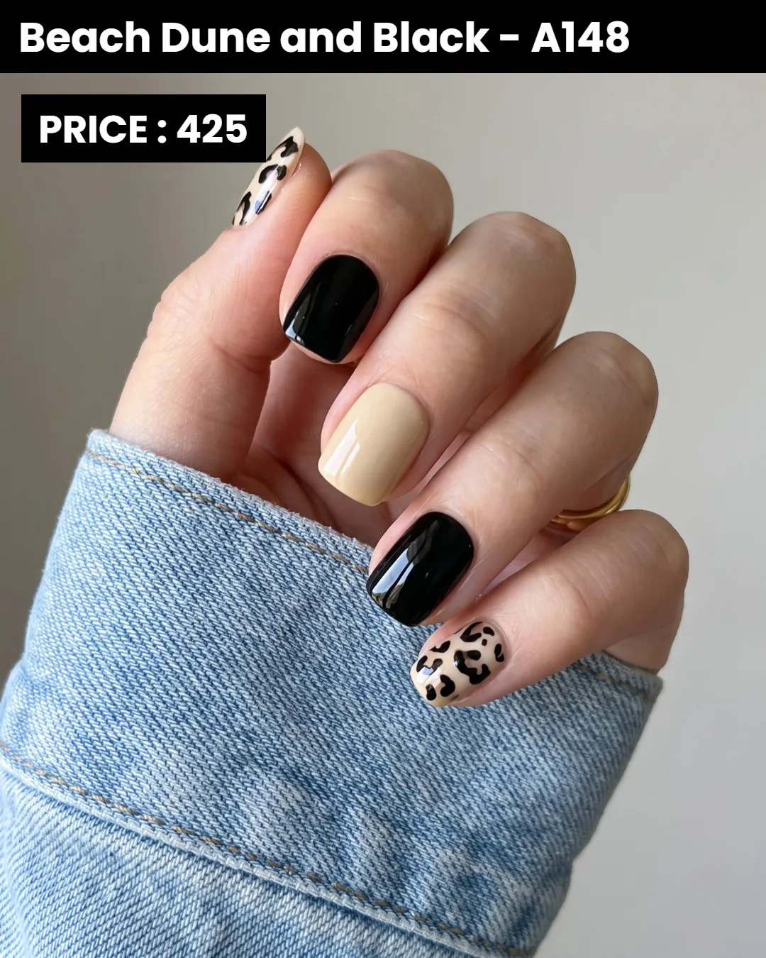 Short black and beige nails with leopard patterned accents