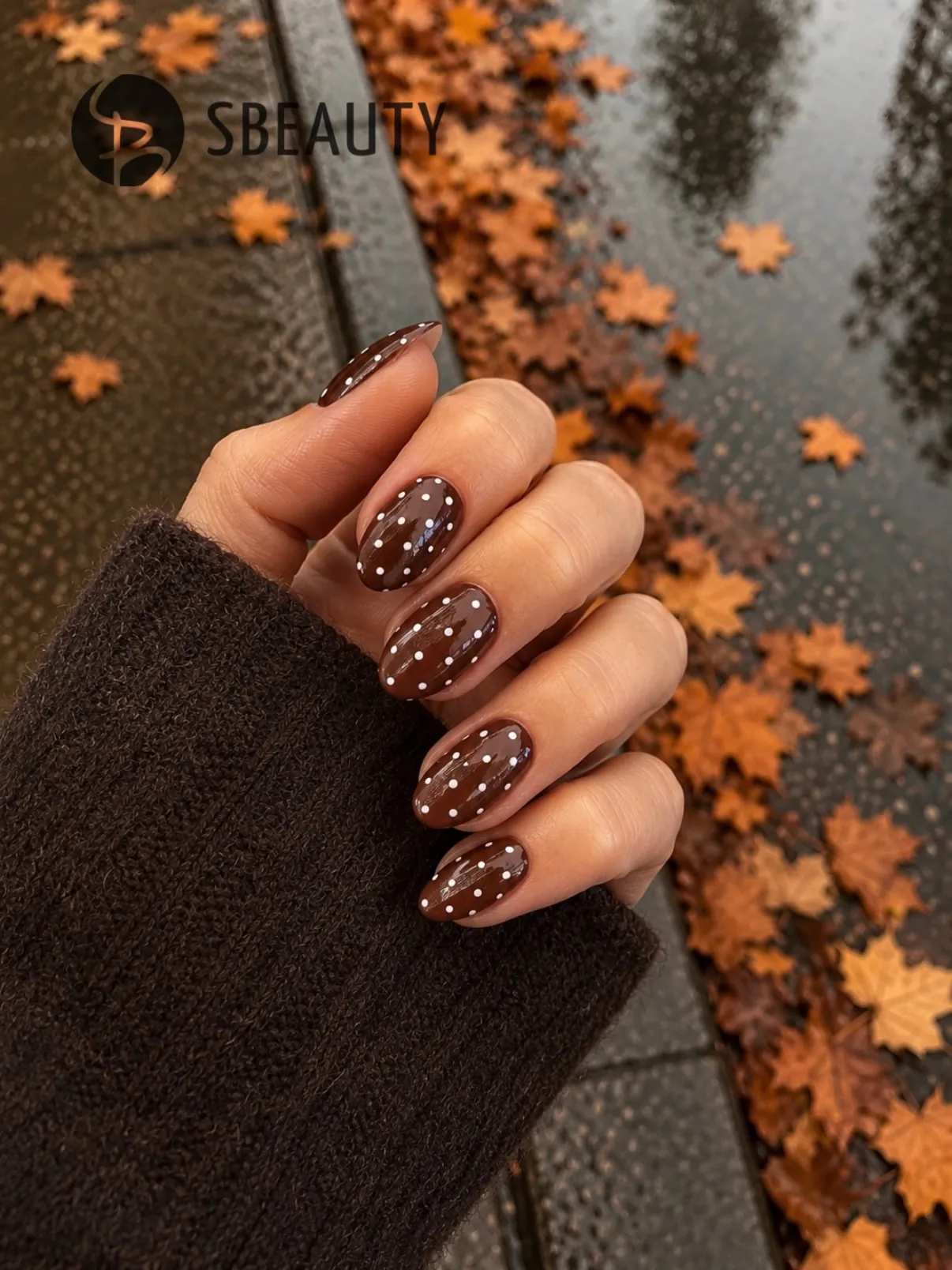 Rounded brown nails with small pale dots across the full surface