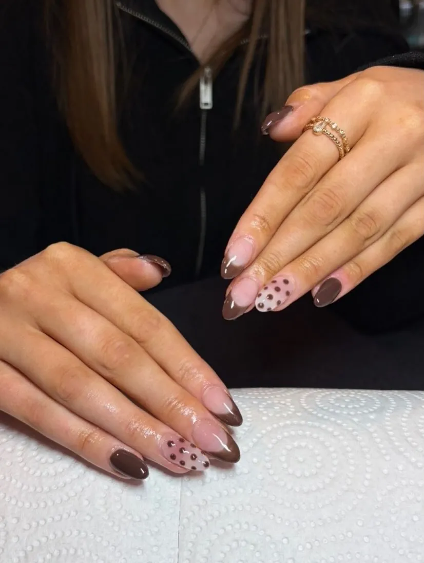 Brown and pink almond French nails with brown dots on pink accent nails
