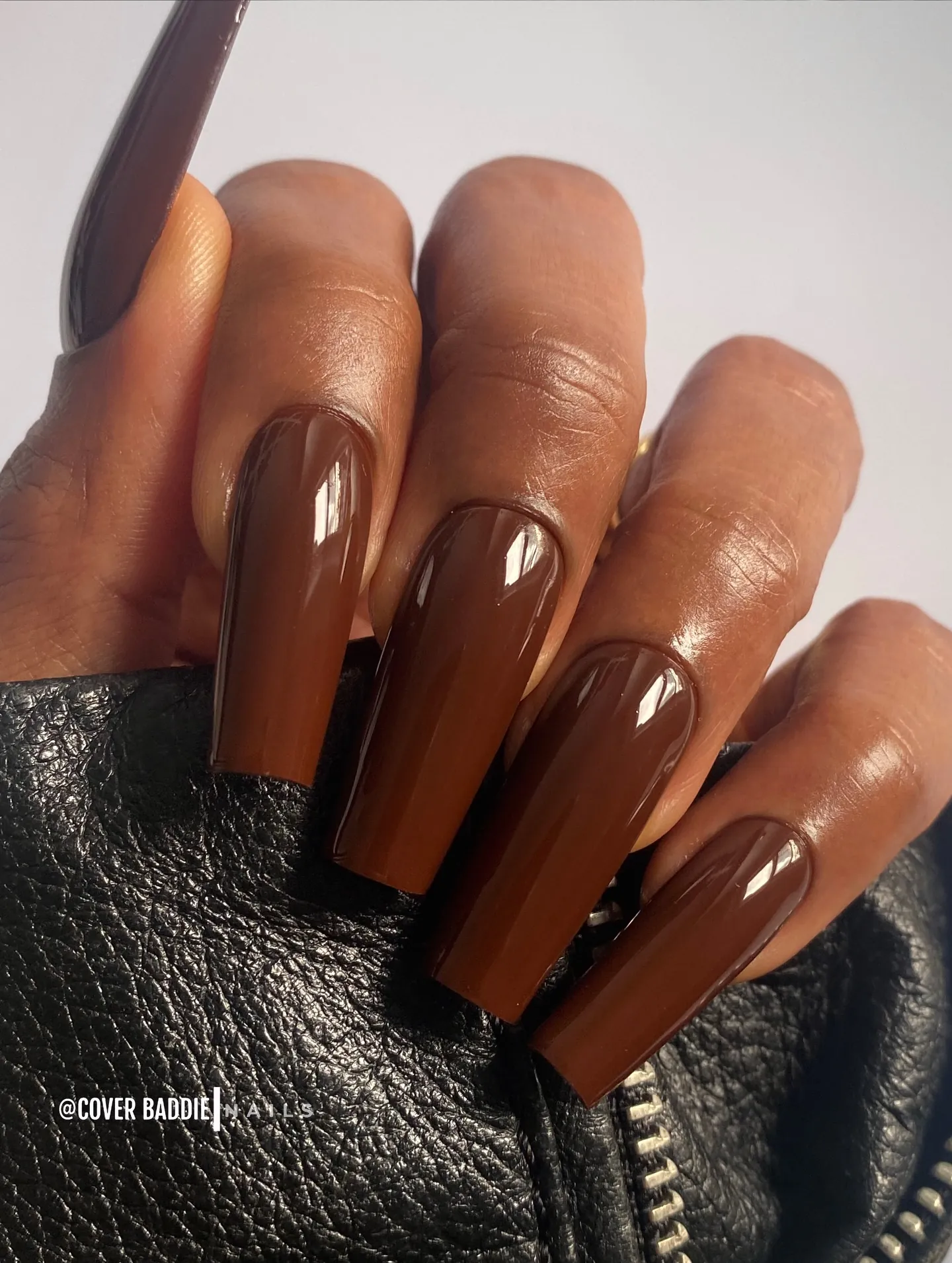 Long square-ended nails with glossy solid espresso brown polish
