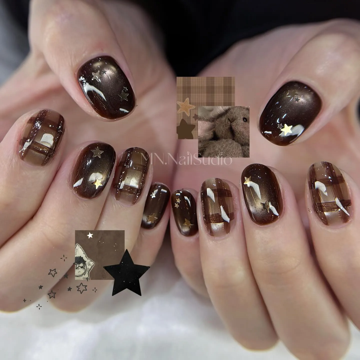Short glossy brown nails with light star details and plaid-like linework