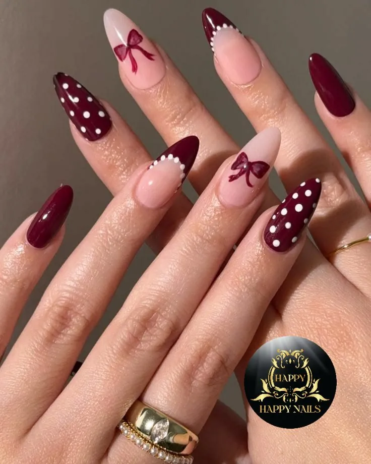 Long almond nails with burgundy bows, white dots and beaded French borders