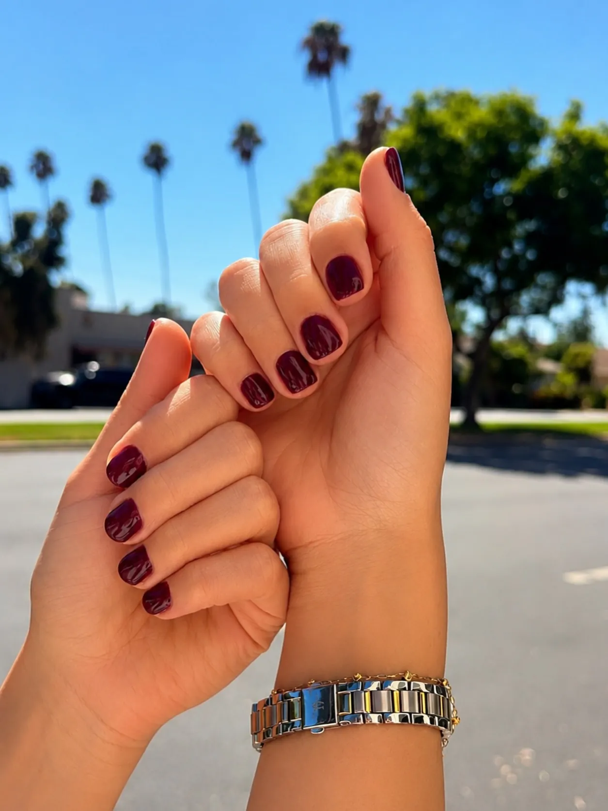 Short burgundy nails with softly squared ends