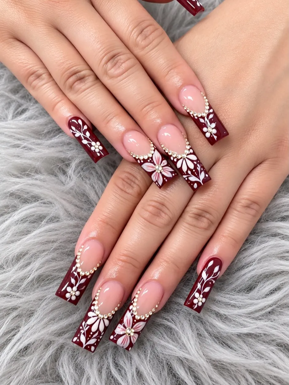 Long burgundy square French tips with white botanical art and crystal borders