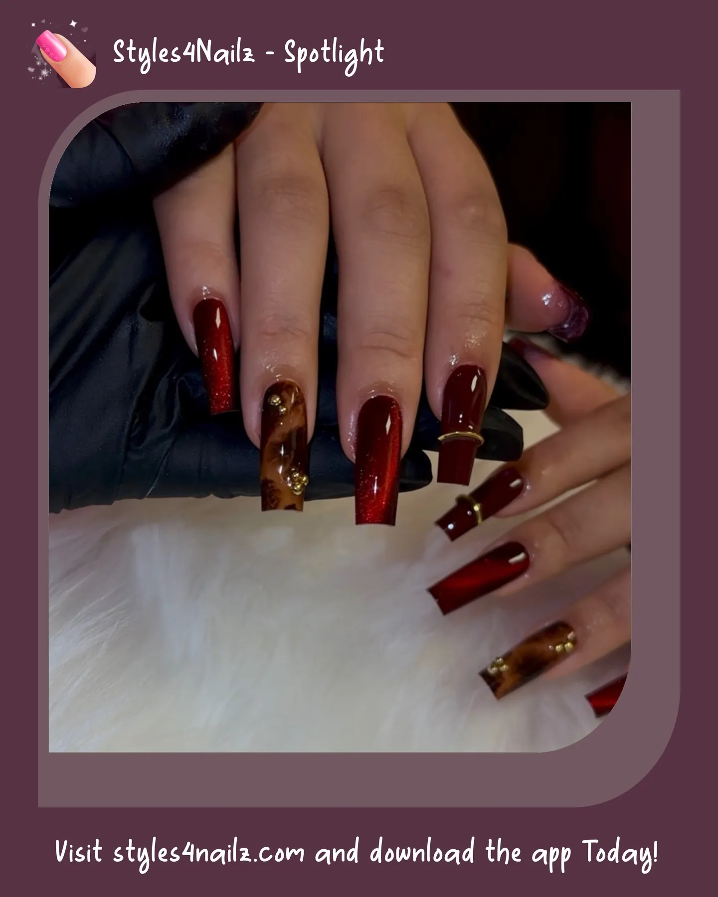 Long burgundy nails with red shimmer tortoiseshell accents and gold bands