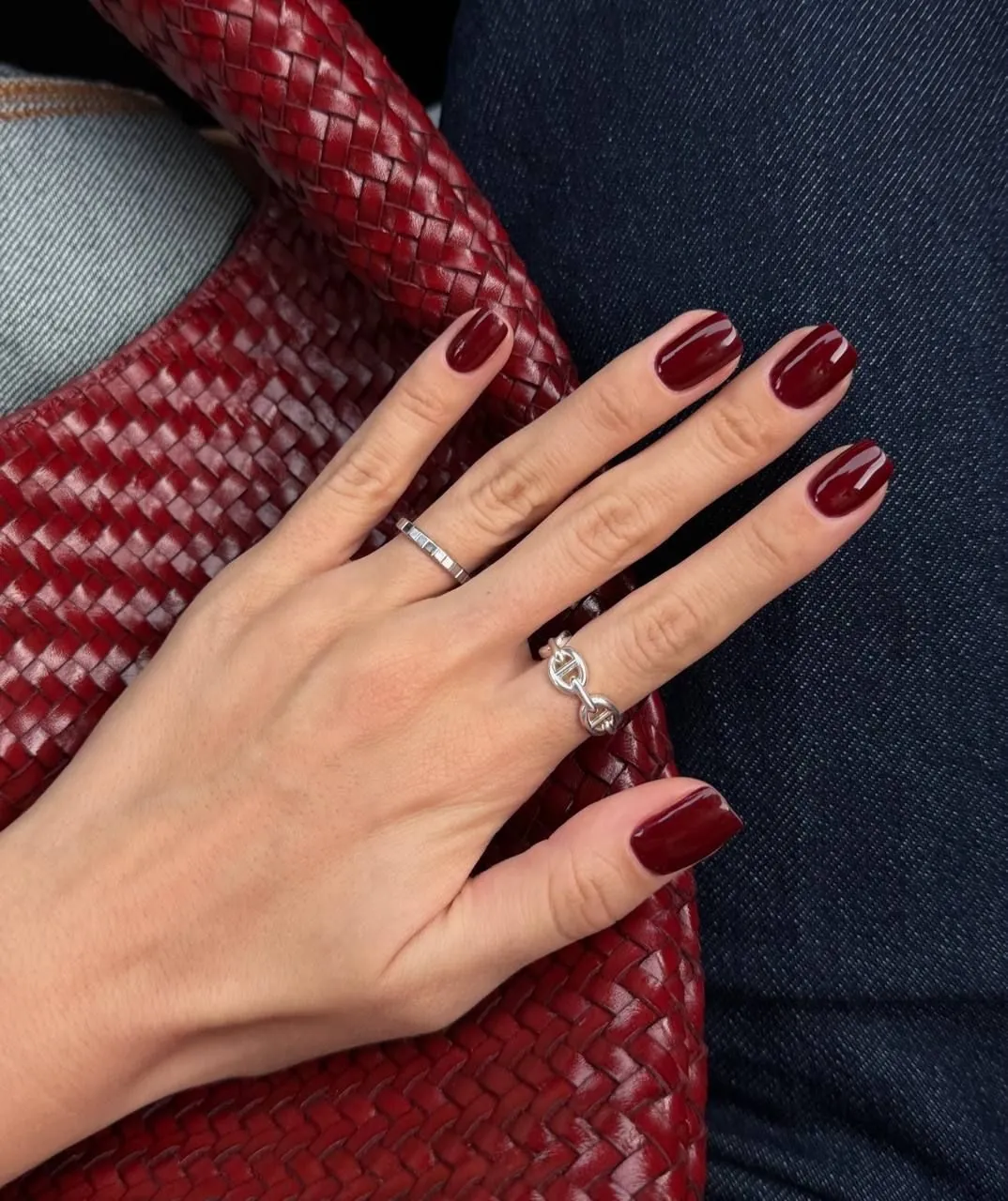 Glossy wine red nails with softly squared tips