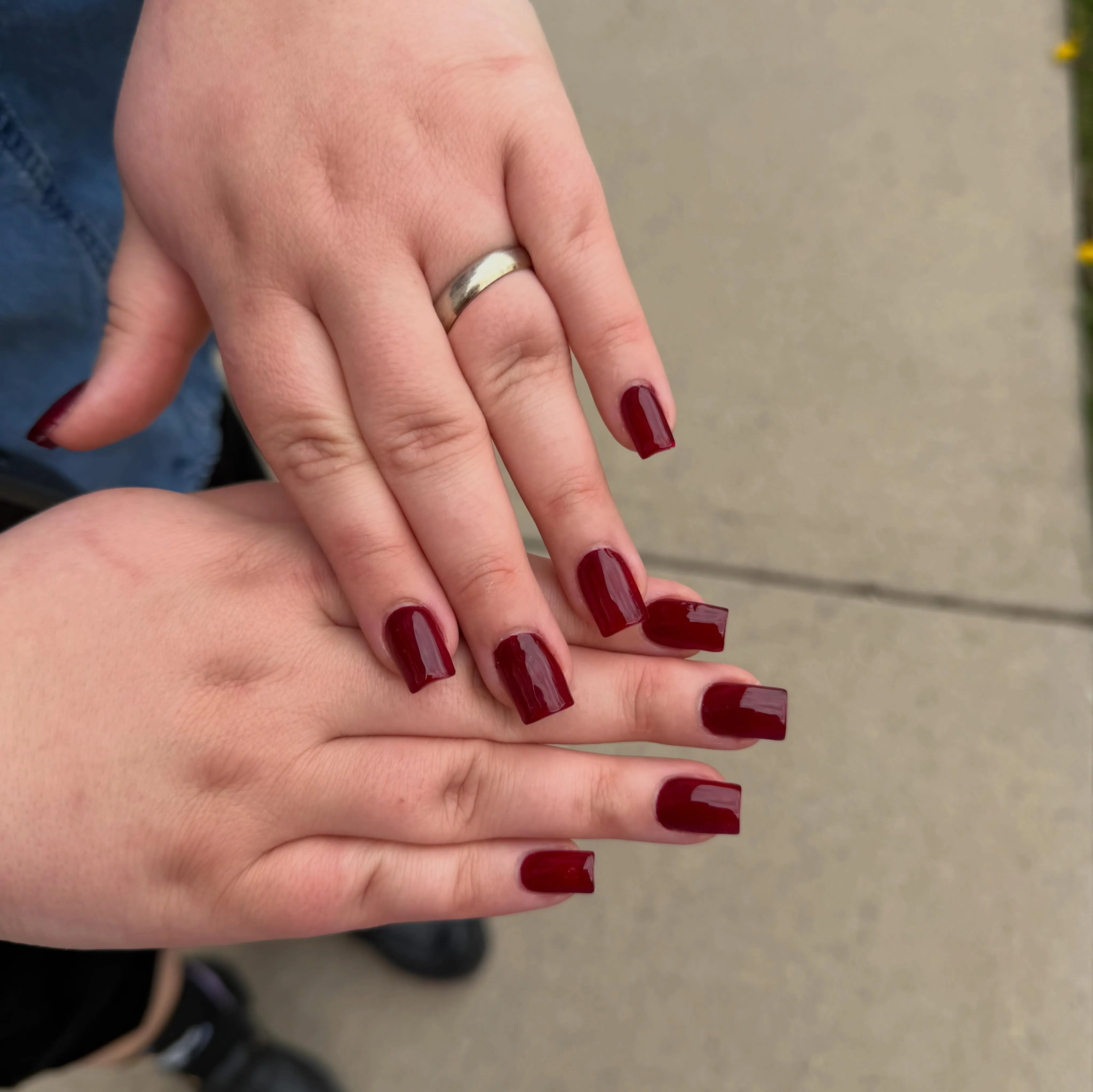 Burgundy nails with straight square ends and a glossy finish