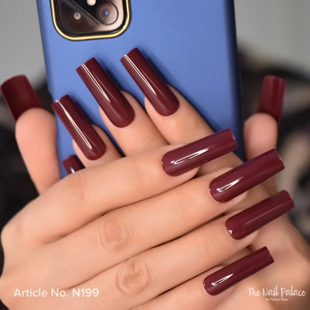 Extra long tapered square nails in glossy burgundy