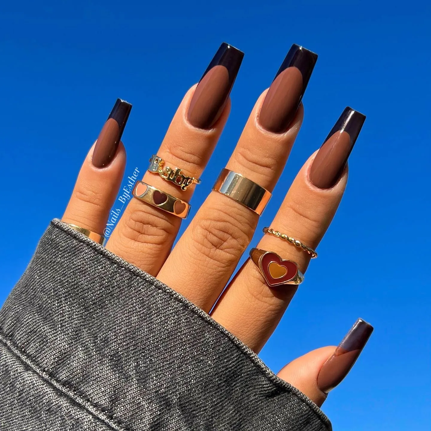 Long square nails with brown bases and darker French tips