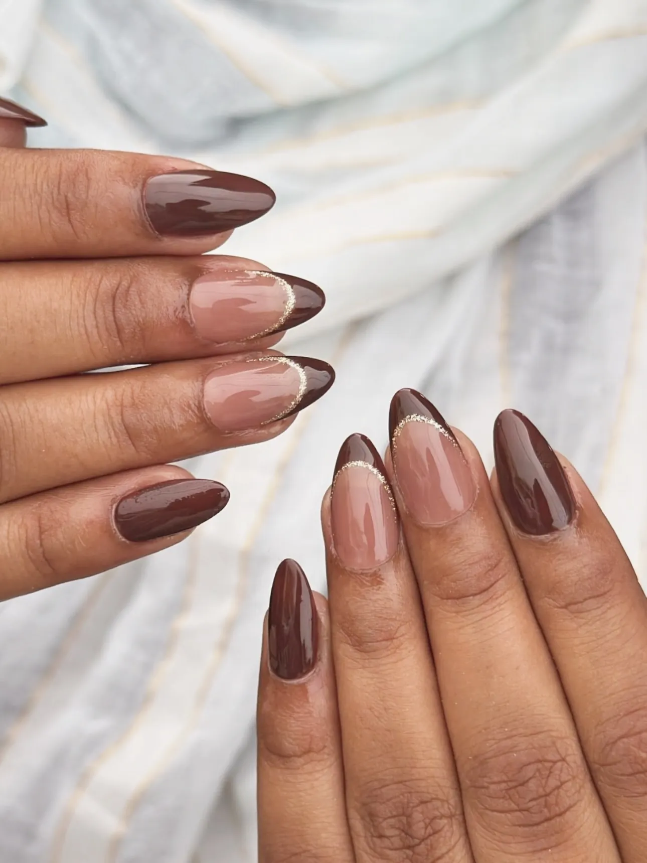 Brown solid almond nails mixed with sheer brown French tips