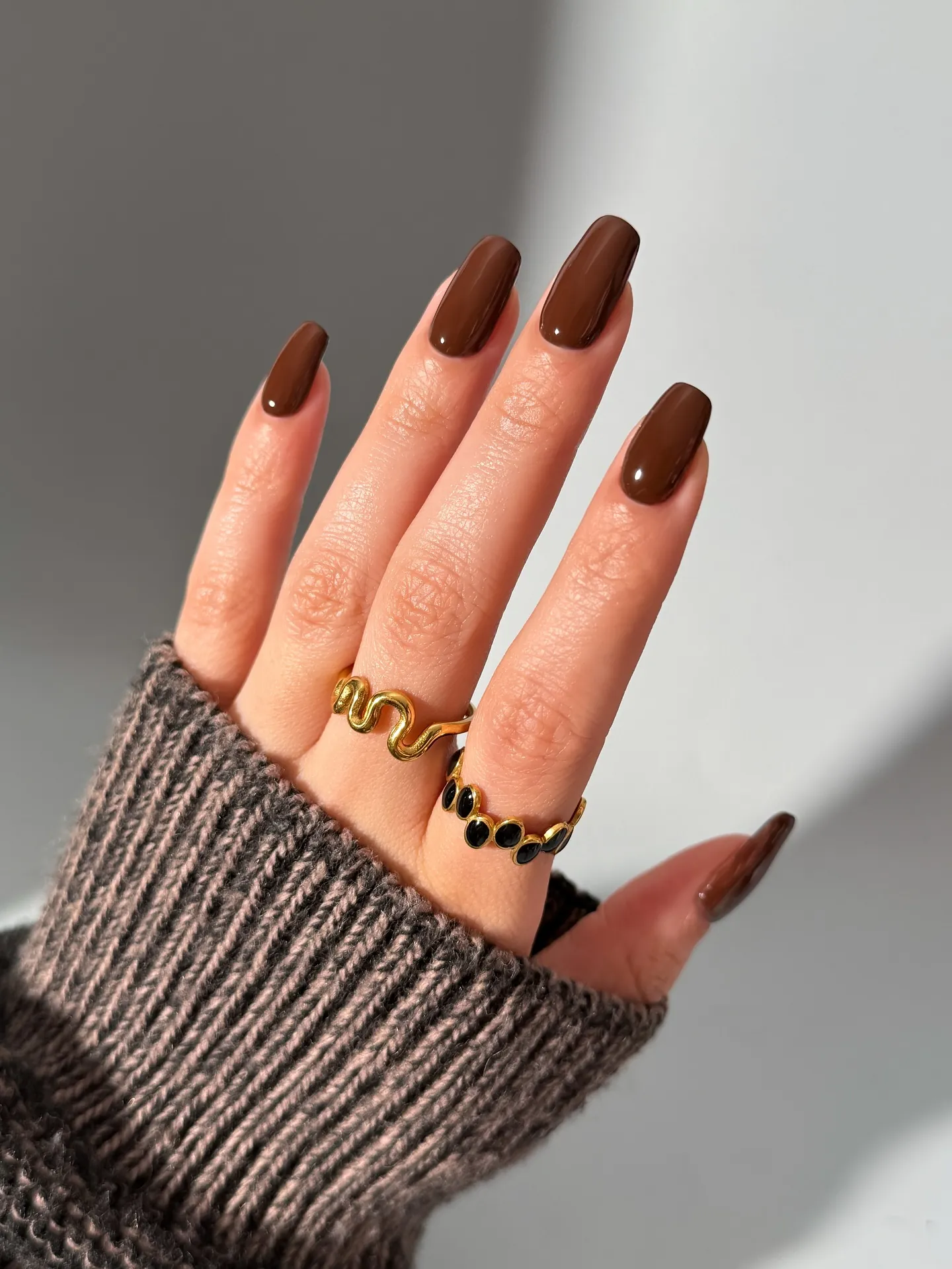 warm brown almonds chocolate brown manicure