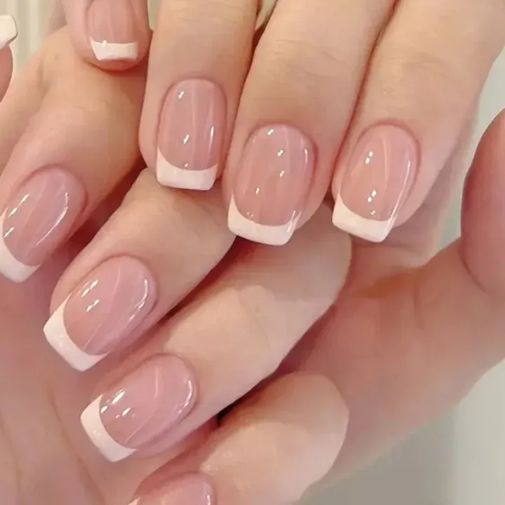 Pink square nails with curved white French borders