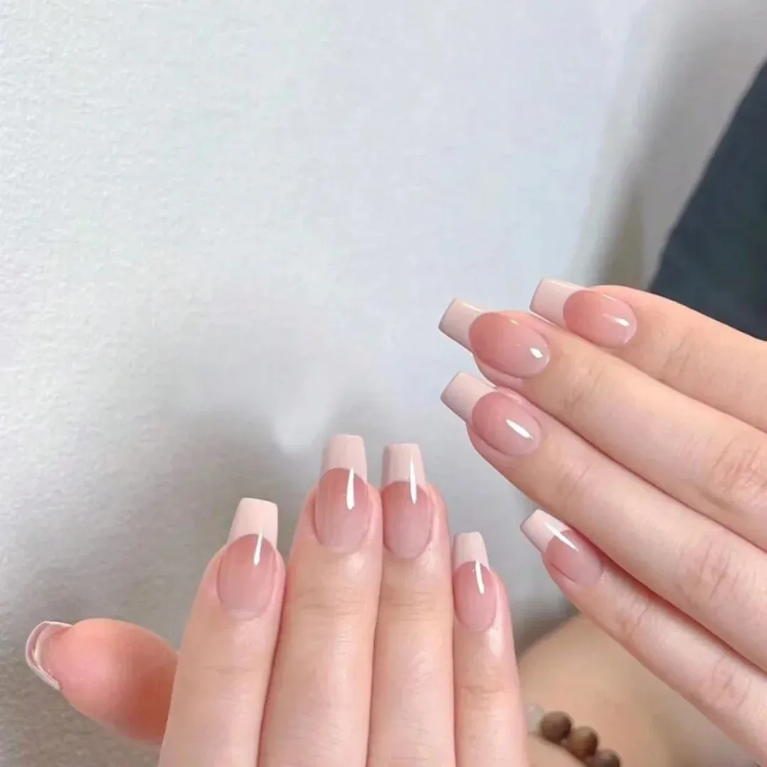 Pink square nails with broad straight white tips