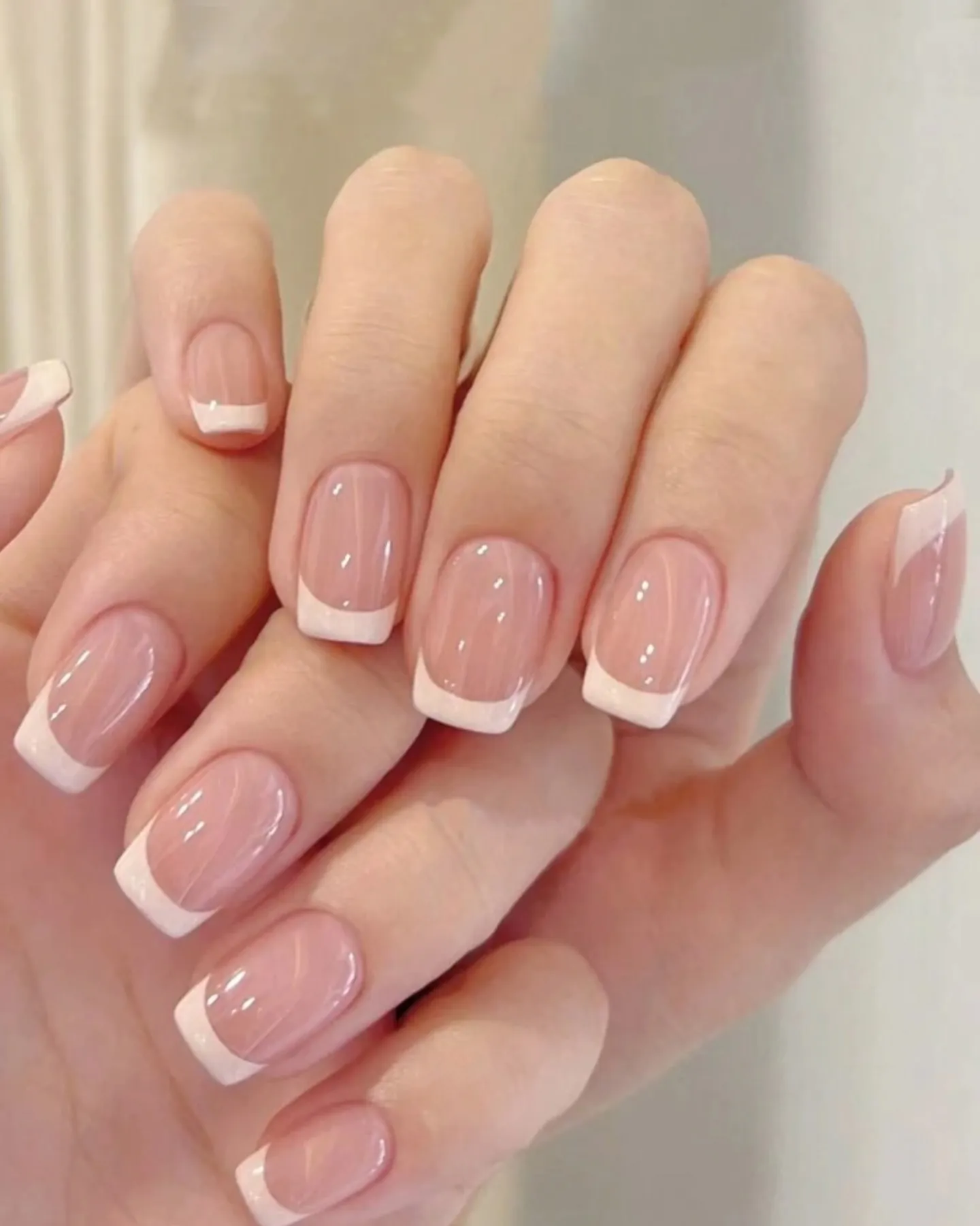 Pink French nails with softly squared corners