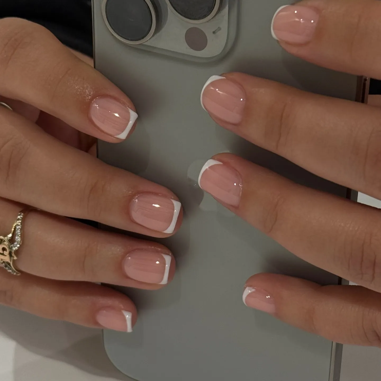 Short nude pink nails with delicate white tips