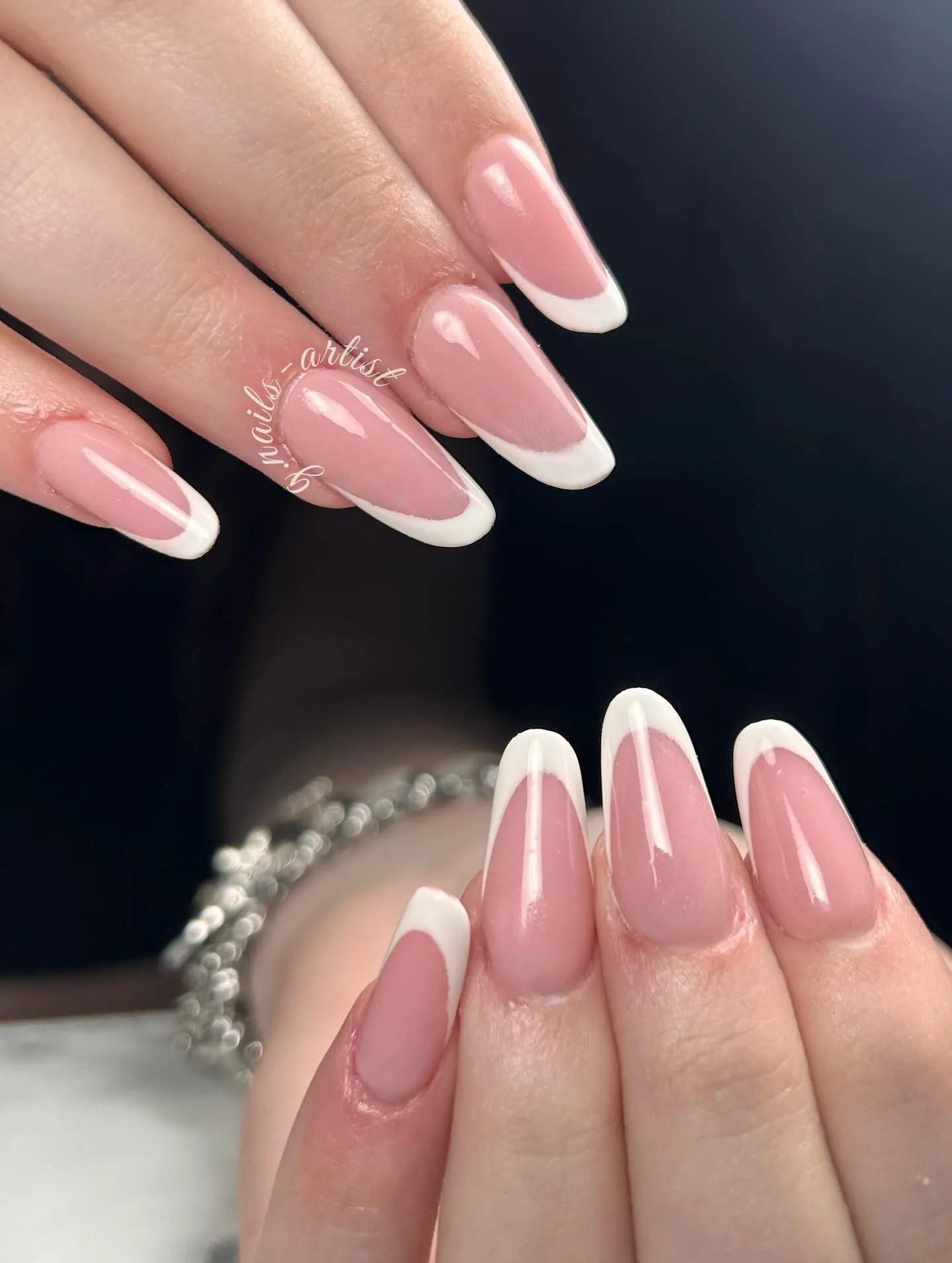 Long pink almond nails with crisp white French tips