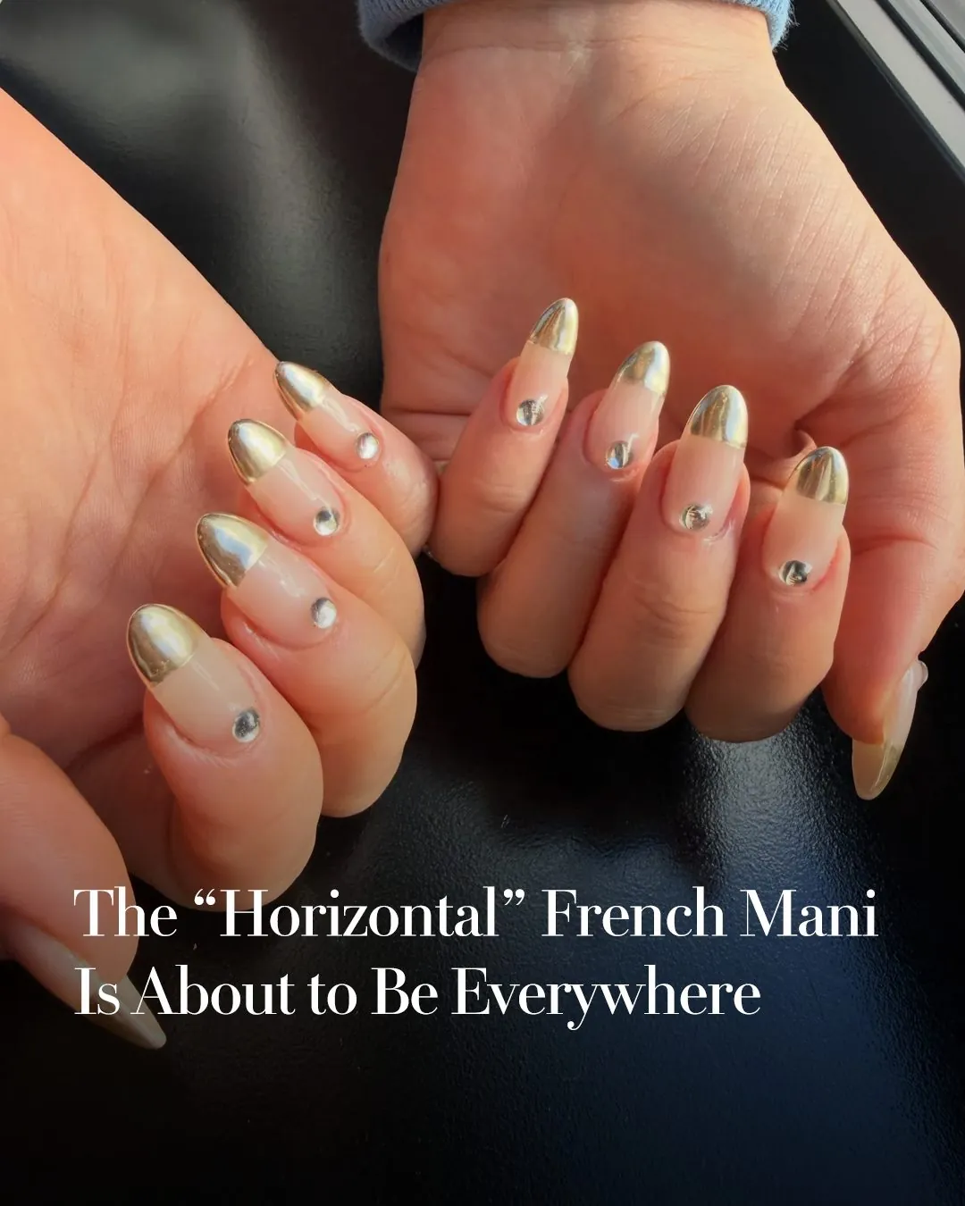 Nude almond nails with metallic French tips and round metallic accents