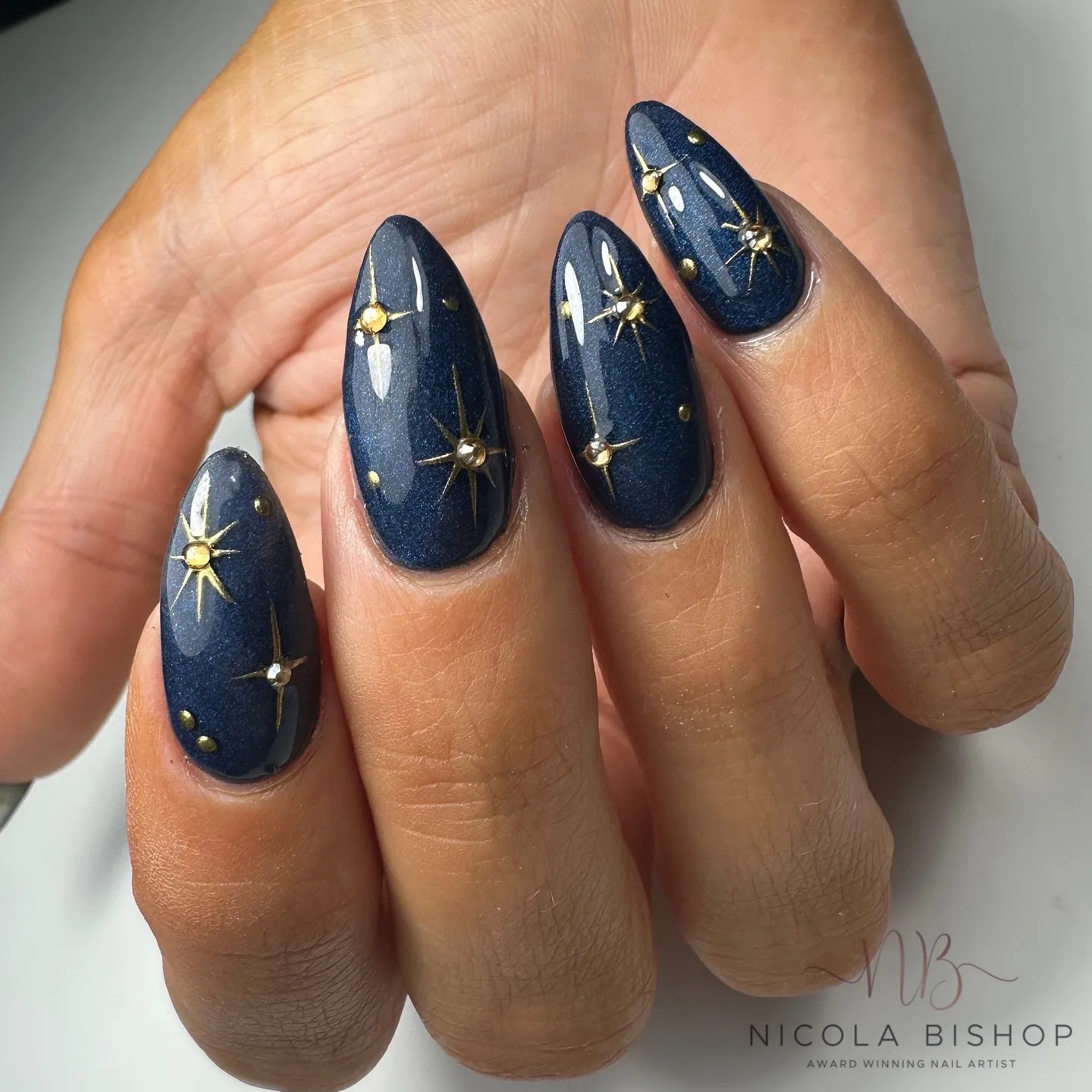 gold starbursts manicure