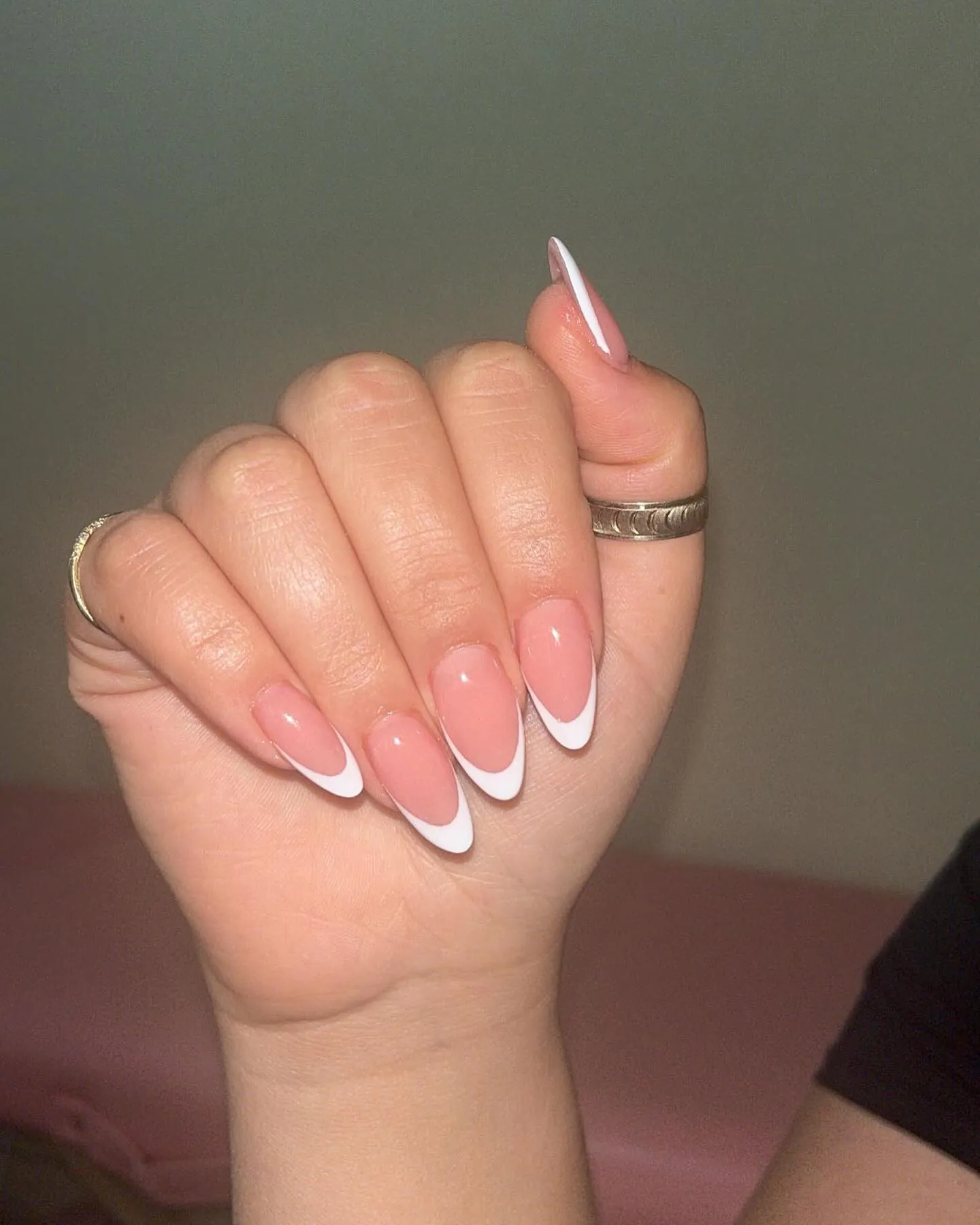 Pink almond nails with fine double white tip outlines