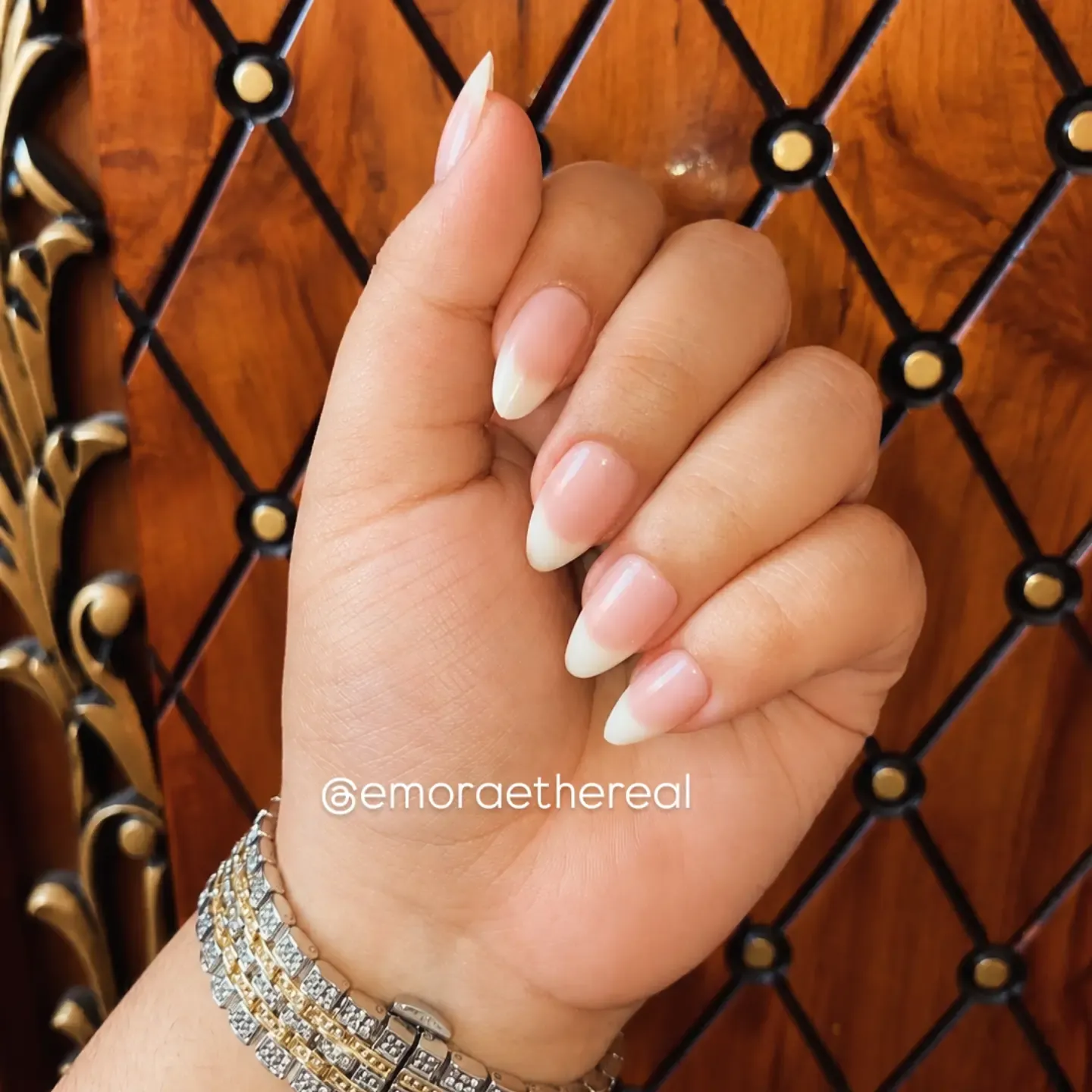 Soft pink almond nails with tapered white French edges