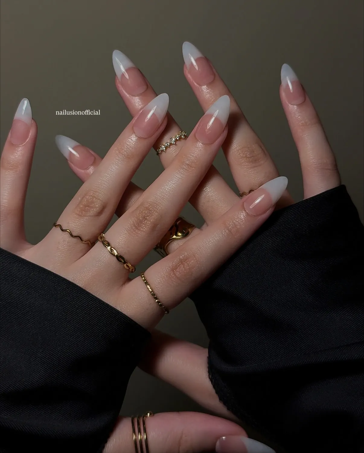 Long pointed almond nails with broad milky white tips