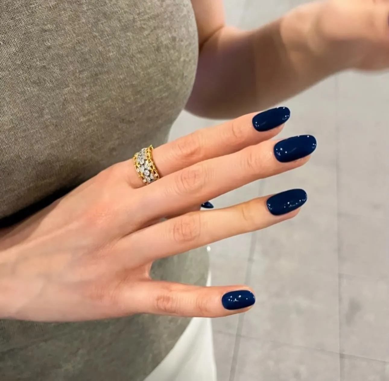 Short navy nails with scattered tiny bright specks