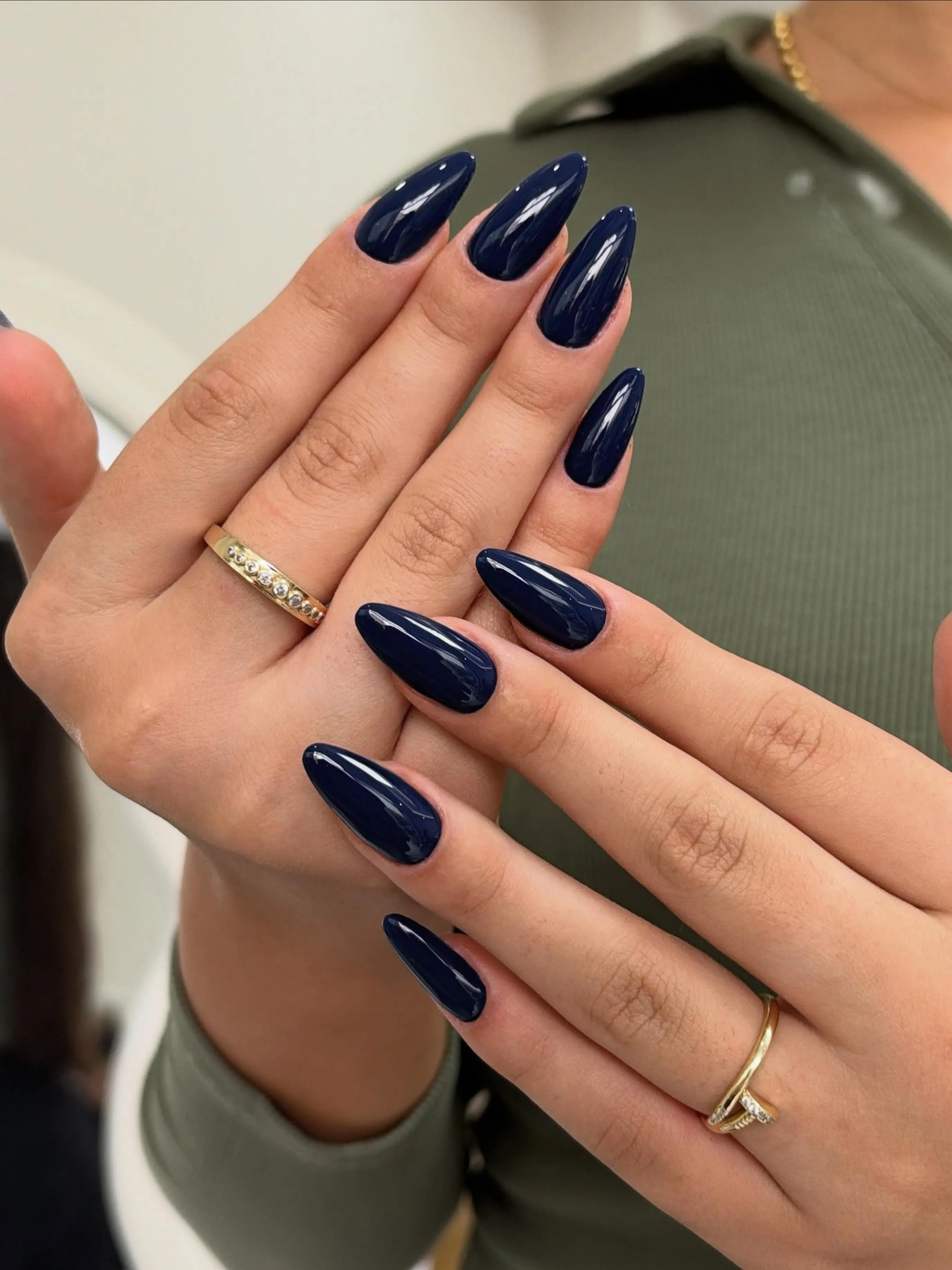Long tapered almond nails with deep navy blue gloss