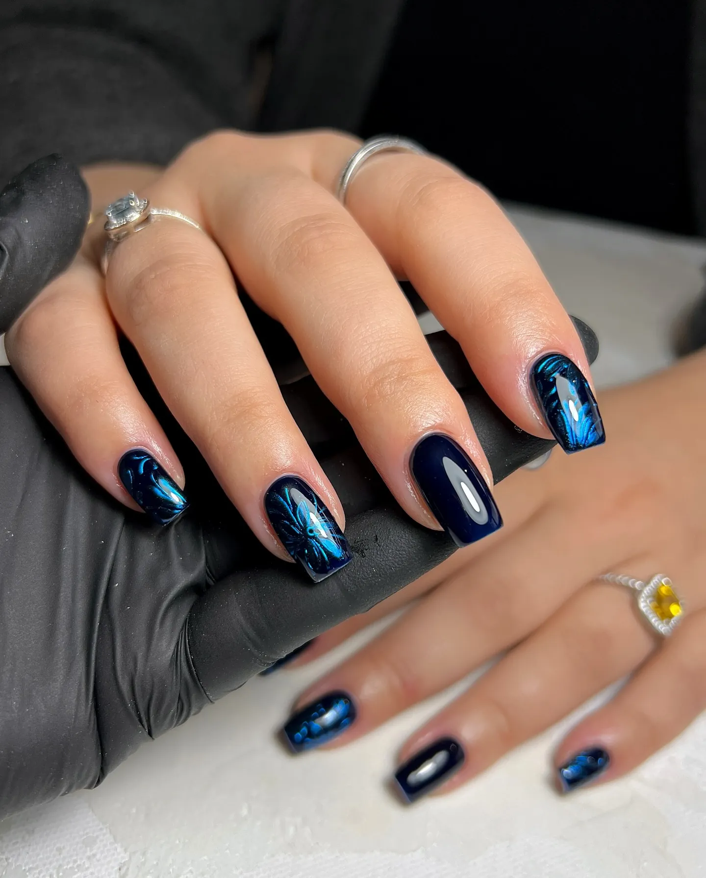 Navy nails with vivid blue shimmering highlights