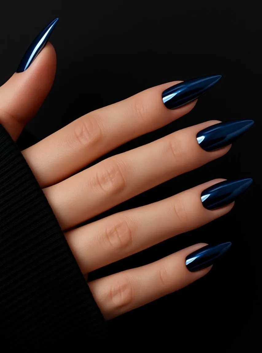 Long pointed navy chrome nails with blue highlights