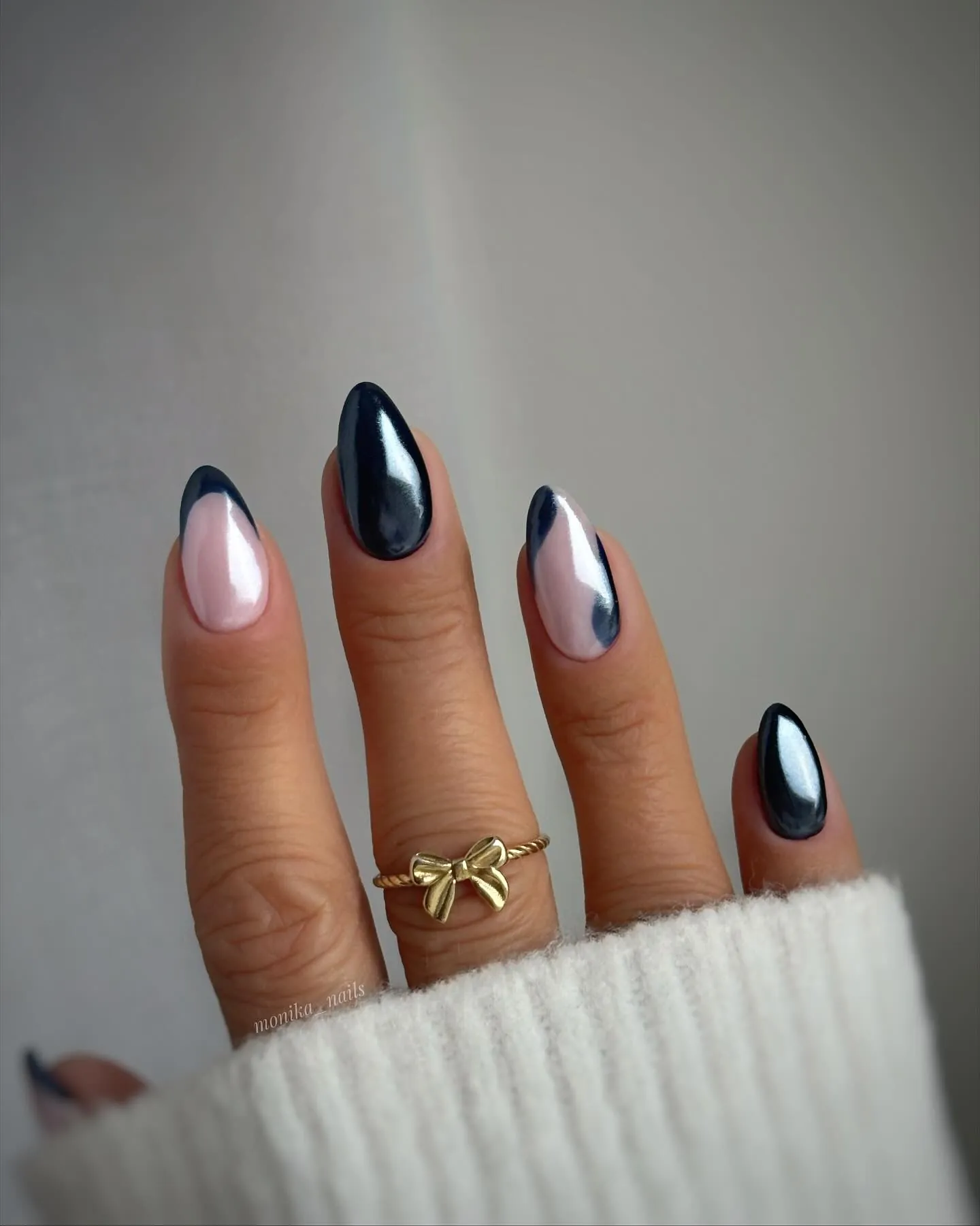 Dark navy wave nails with nude negative space