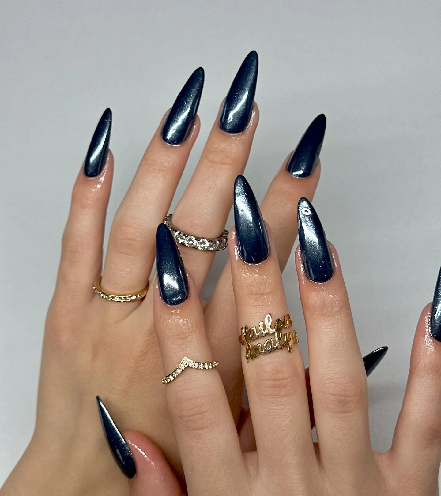 Long metallic navy blue stiletto nails