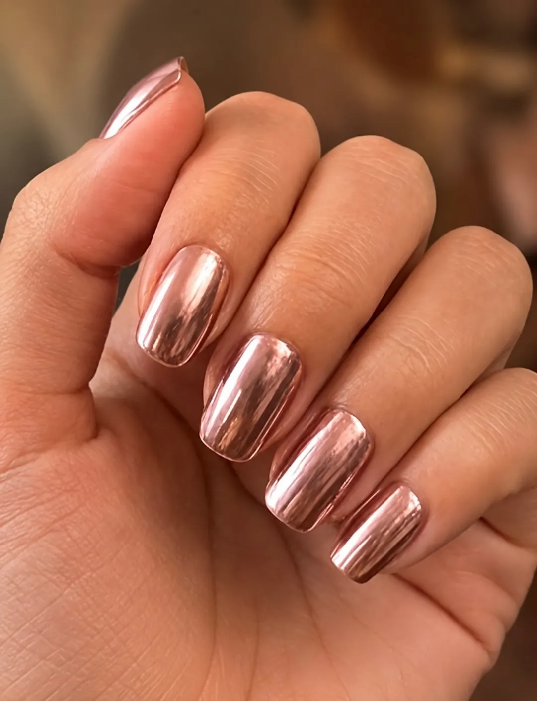 Square nails with an even rose gold mirror finish